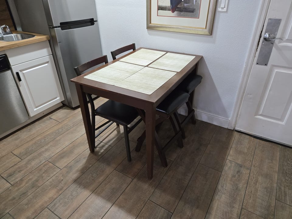Bright and welcoming table for four—perfect for meals or game nights.