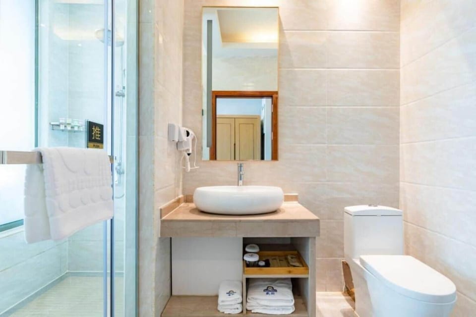 Shower, free toiletries, hair dryer, slippers