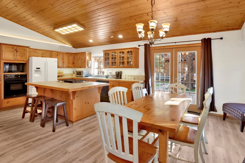 Fully equipped cabin kitchen with ample cabinetry, stove, fridge, microwave, and coffee maker—perfect for cooking meals, morning coffee, and feeling right at home on your stay.