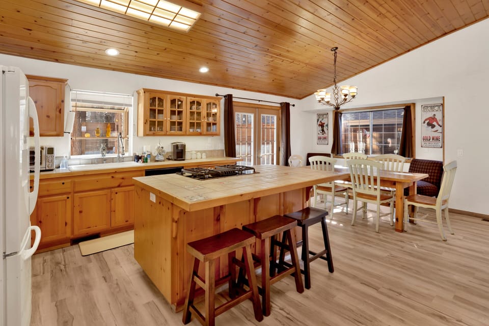 Fully equipped cabin kitchen with ample cabinetry, stove, fridge, microwave, and coffee maker—perfect for cooking meals, morning coffee, and feeling right at home on your stay.