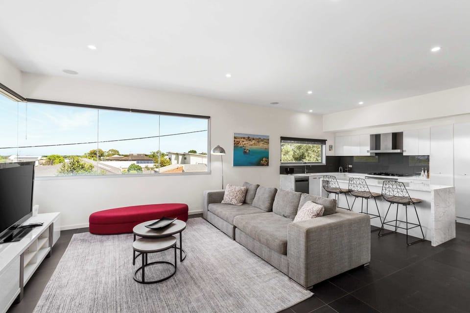 Enjoy distant rural views from the upper level, and cosy evenings by the fireplace while you watch a movie
