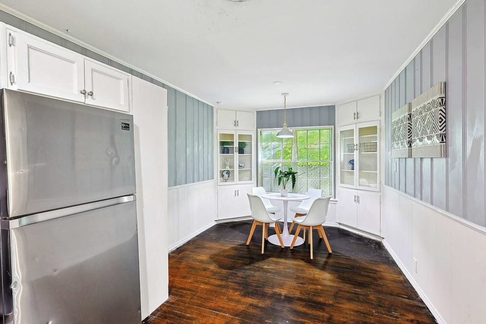 
Refrigerator and dining area in open layout