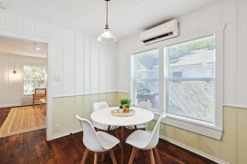 Start your mornings with a cup of coffee or gather for intimate meals in this bright and inviting dining area