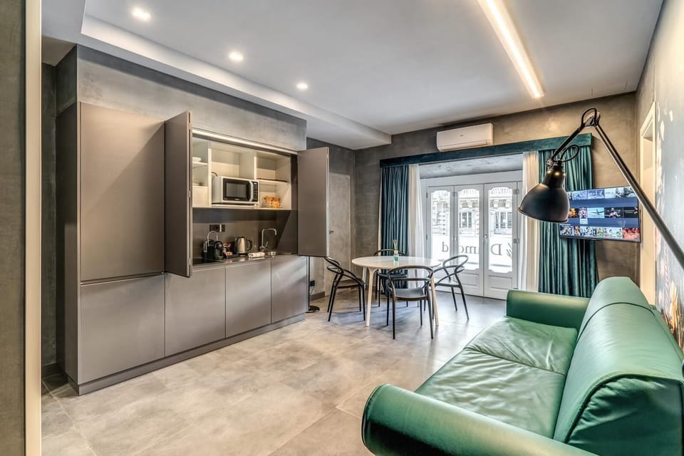 Deluxe Apartment | Living area | TV