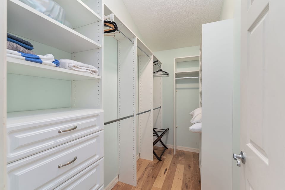 Amazing master  walk-in closet with built in drawers, space for shoes and plenty of hanging clothes.