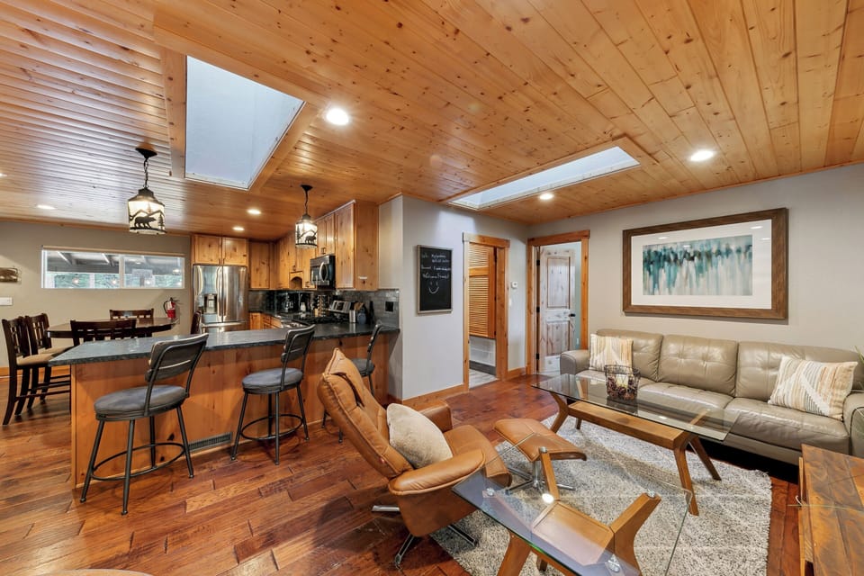 Gather with loved ones in this warm, open-concept space where rich wood beams and modern comfort create your perfect mountain retreat.