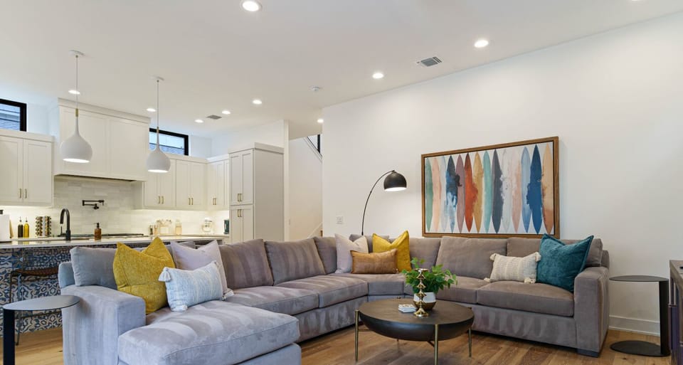 Room for everyone—this spacious couch invites you to lounge, relax, and connect. Perfect for movie nights, cozy chats, or simply stretching out in the open, airy living space.