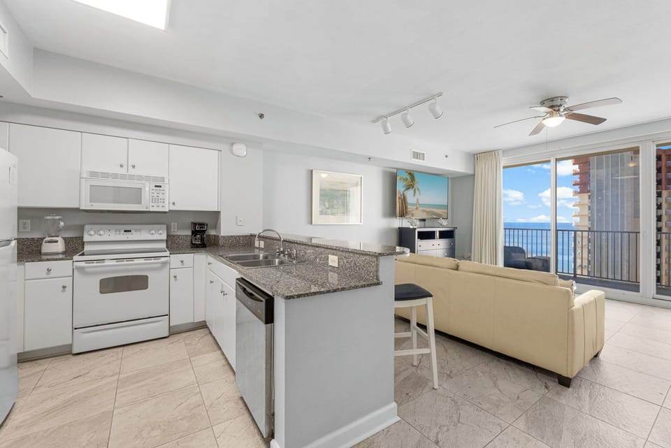 Modern kitchen and living area with ocean views and natural light