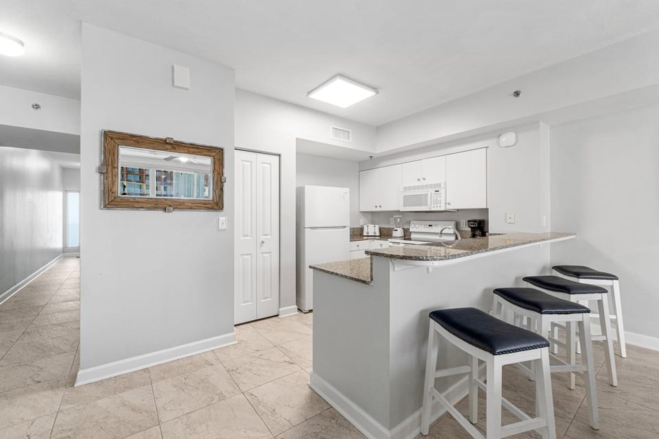 modern kitchen with breakfast bar and seating for three