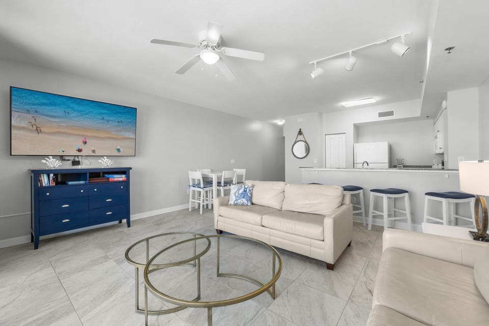Open-concept living area with modern furnishings and a coastal-inspired design.