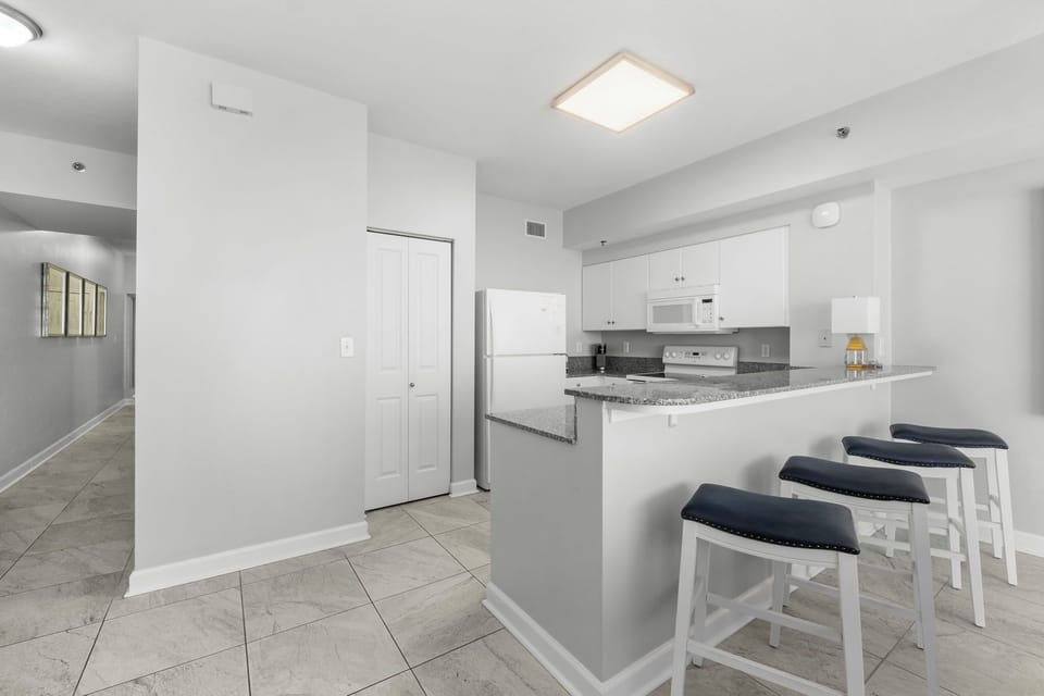 modern kitchen with a breakfast bar and seating for three