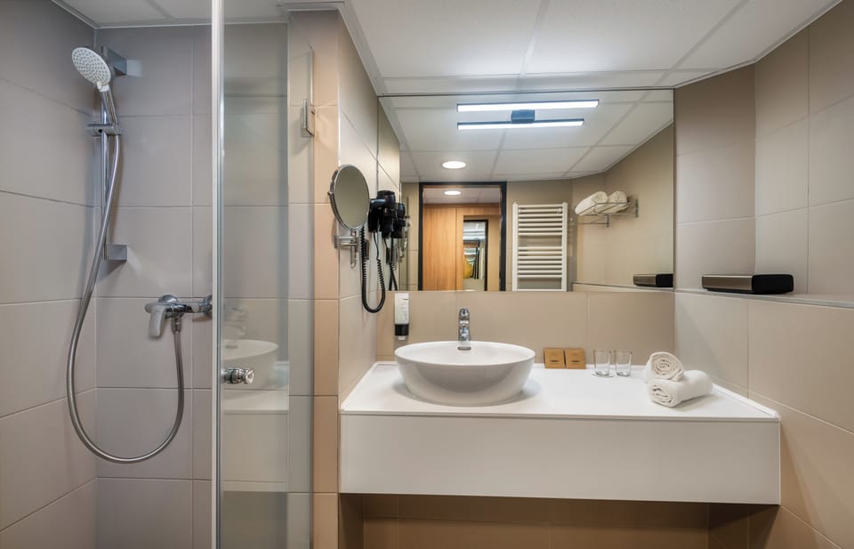 Standard Double or Twin Room | Bathroom | Shower, free toiletries, hair dryer, bathrobes