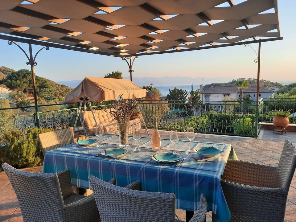 Outdoor dining area with barbecue
