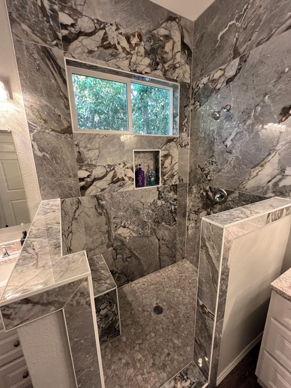 Walk in shower. Take a seat to relax