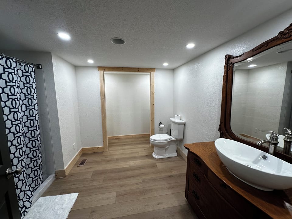 Spacious Master Bath with marble walk-in shower.