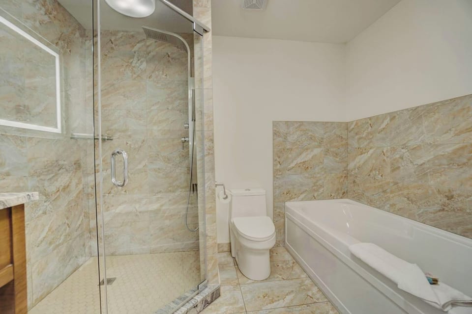 Powerful rain shower with innovative features. Oversized soaker tub to relax