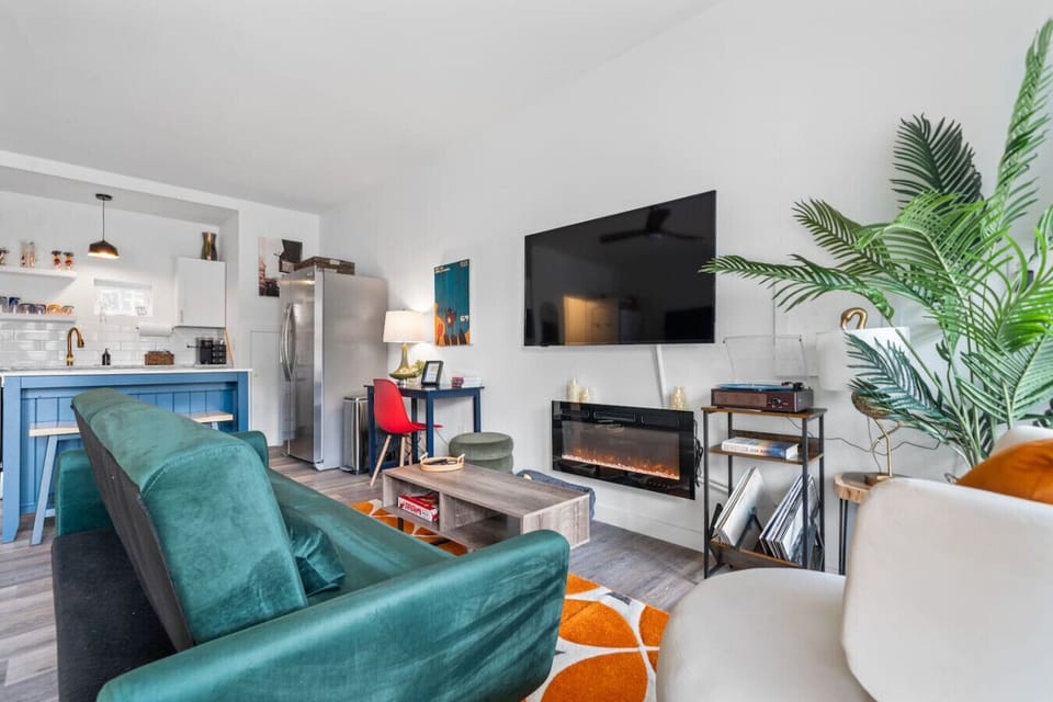 Living area with smart tv and fireplace.