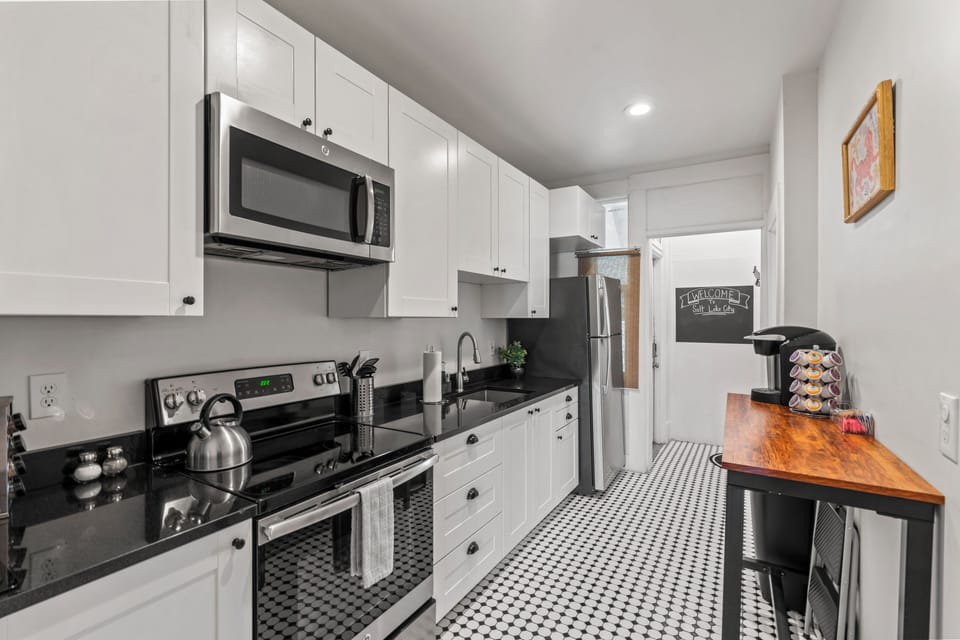 Galley kitchen stocked with all you need to cook, dine and get your coffee fix.