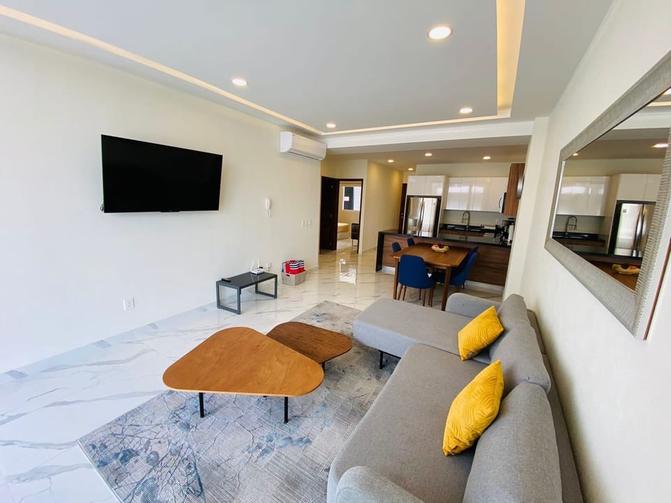 Deluxe Apartment, Balcony, Pool View | Living room | Flat-screen TV