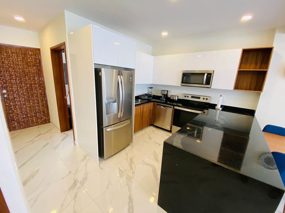 Deluxe Apartment, Balcony, Pool View | Private kitchen | Coffee/tea maker, electric kettle, toaster