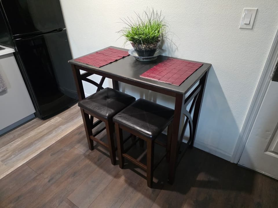 Bright and welcoming table for four—perfect for meals or game nights.