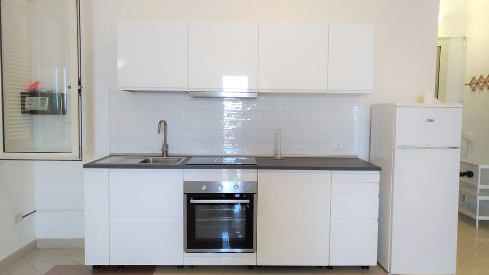 Apartment, 1 Bedroom, Terrace, Sea View | Down comforters, minibar, desk, iron/ironing board
