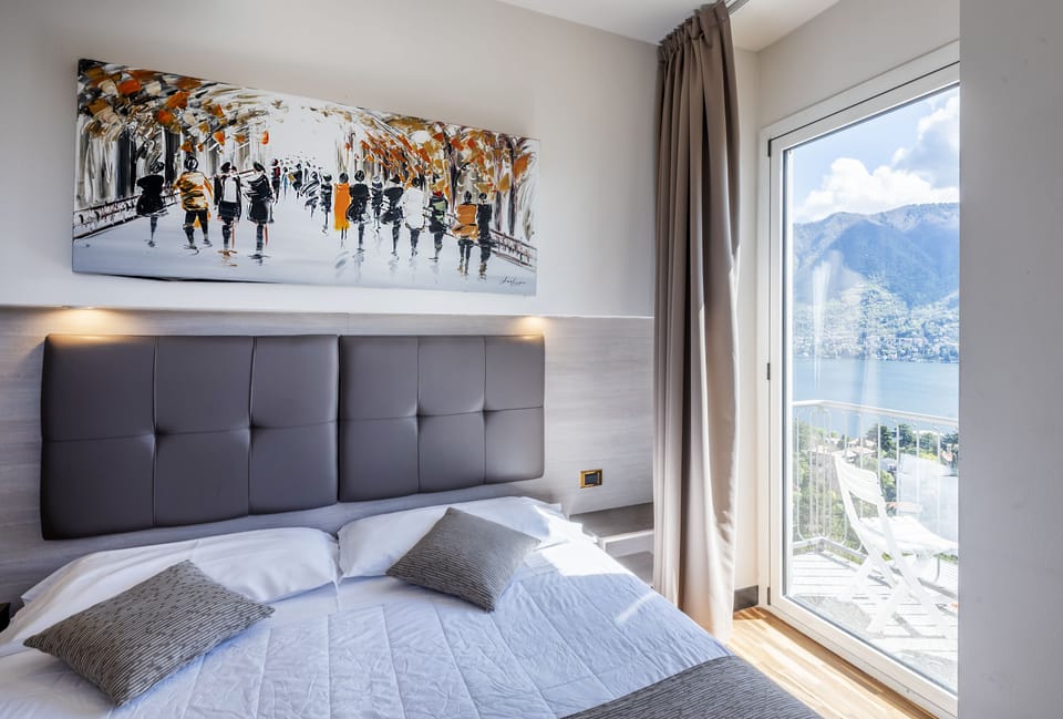 Standard Double Room, Balcony, Lake View | Minibar, in-room safe, desk, laptop workspace