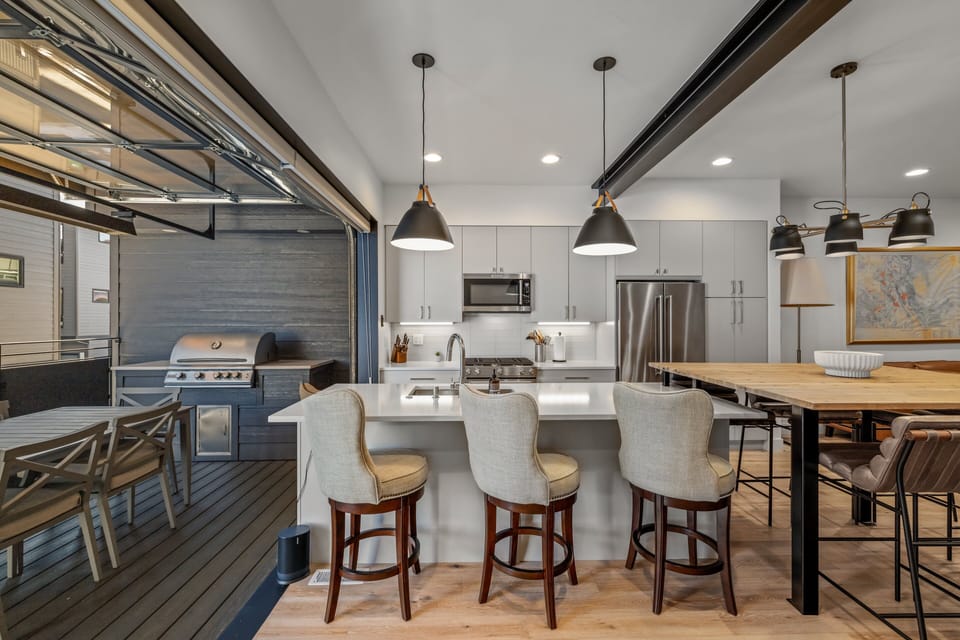 Extend the dining space by opening the garage door in the warmer months