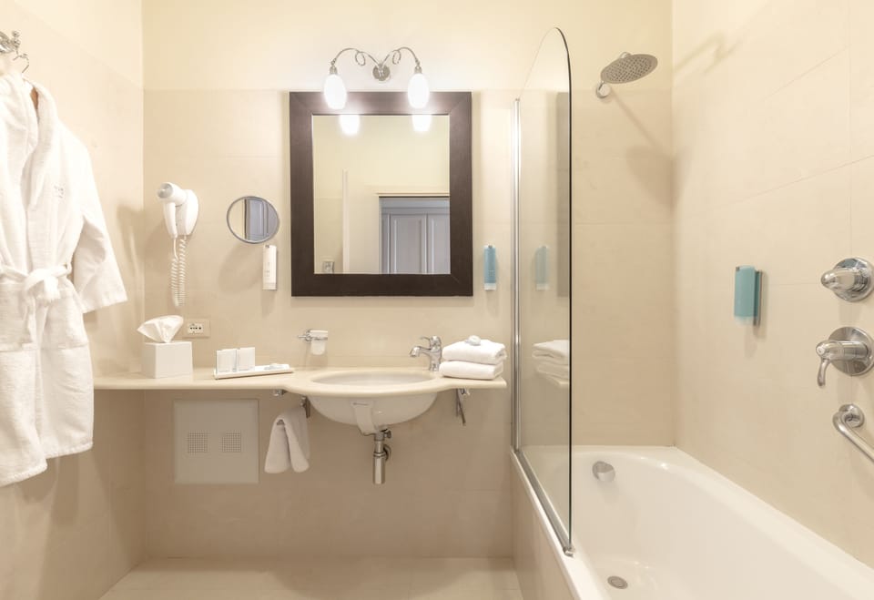 Eco-friendly toiletries, hair dryer, bathrobes, slippers