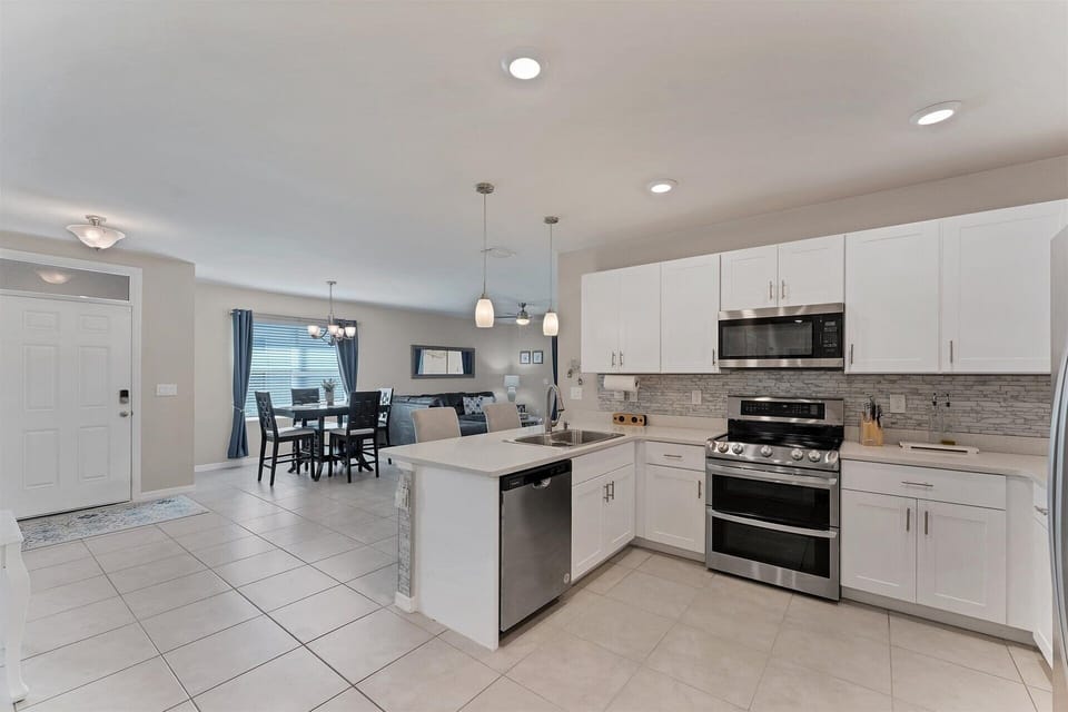 Fully-equipped kitchen overlooking the dining room and living room