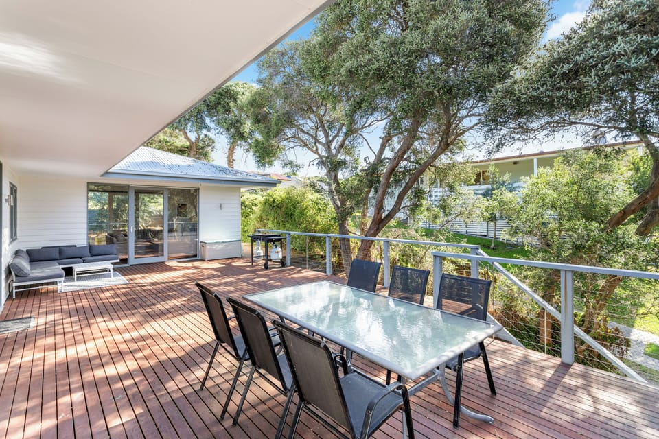 Savor serene views and fresh air on our inviting outdoor deck