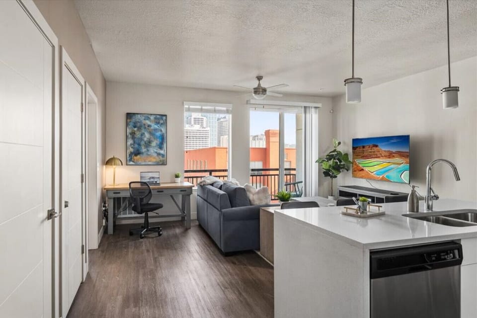 Beautifully designed living room. 75` TV, Queen sleeper sofa and amazing views of mountains and city skyline.