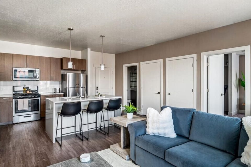 Beautifully designed living room. 75` TV, Queen sleeper sofa and amazing views of mountains and city skyline.