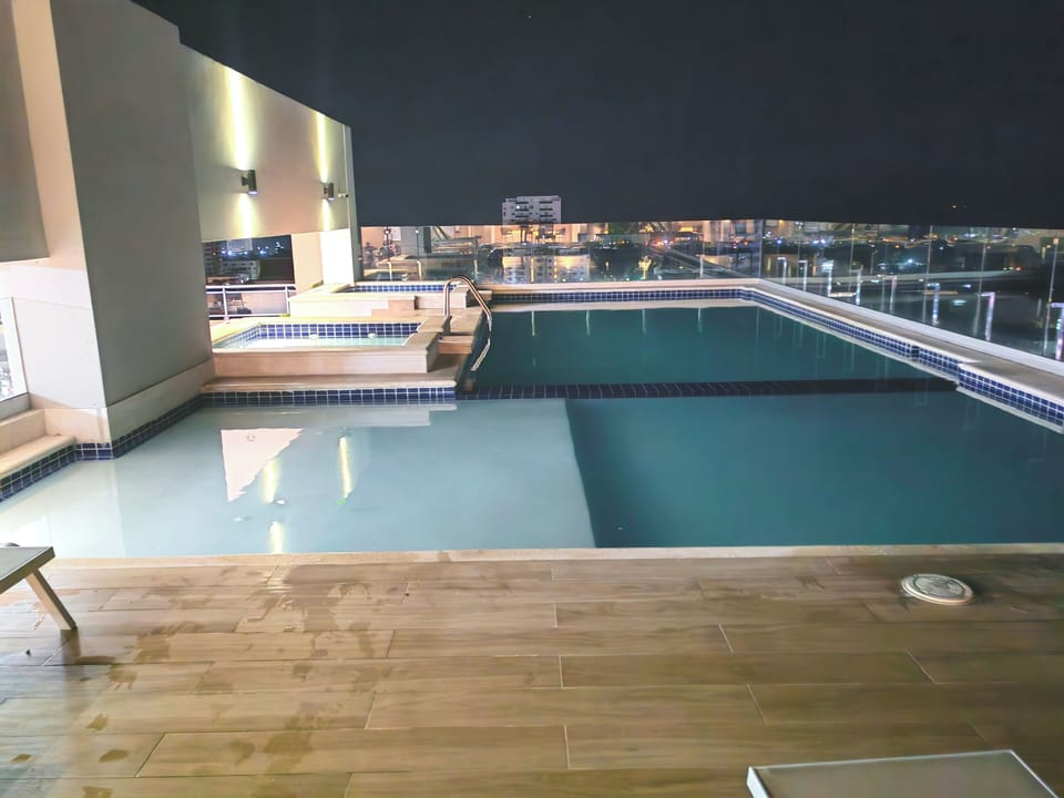 Outdoor pool, pool umbrellas, sun loungers