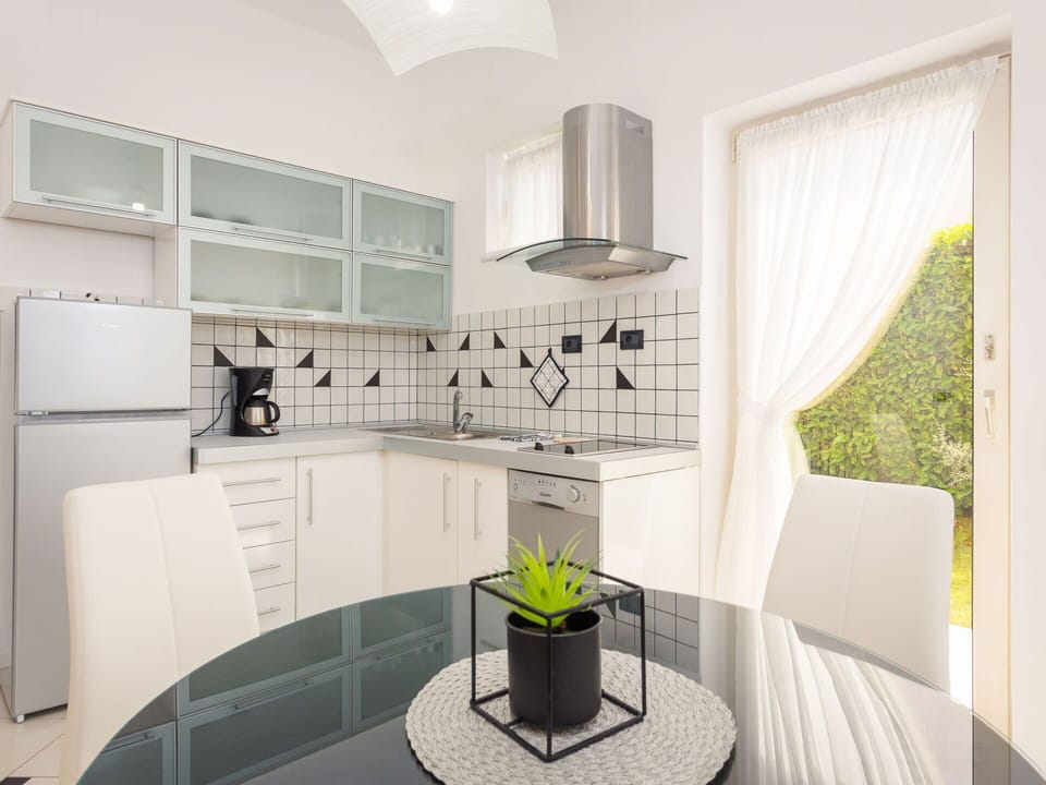 Furniture, Interior Design, Kitchen, Flooring, Countertop, Floor, Ceiling, Kitchen Appliance, Room, Lighting