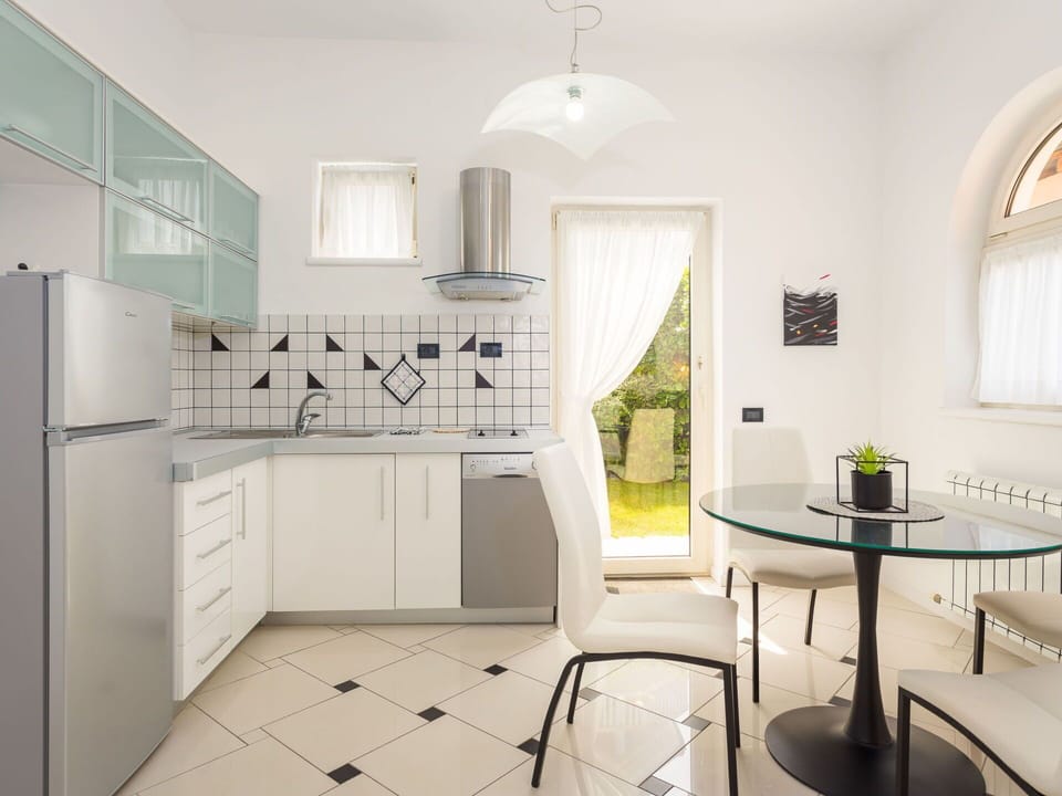 Furniture, Interior Design, Flooring, Floor, Kitchen, Ceiling, Chair, Lighting, Kitchen Appliance, Countertop