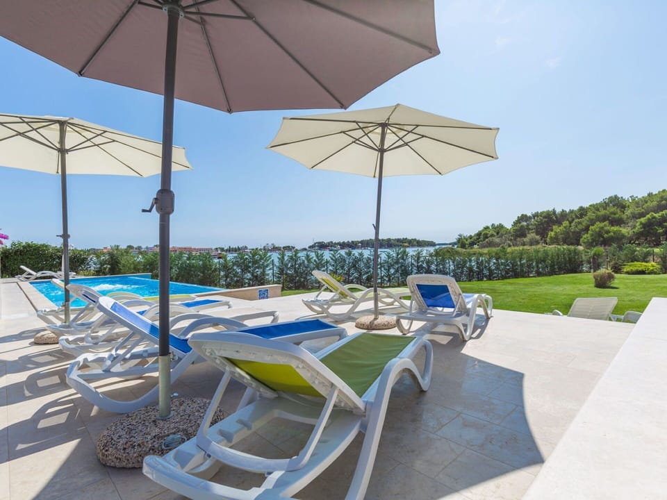 Blue, Outdoor Furniture, Swimming Pool, Shade, Chair, Umbrella, Sunlounger, Garden, Leisure, Resort