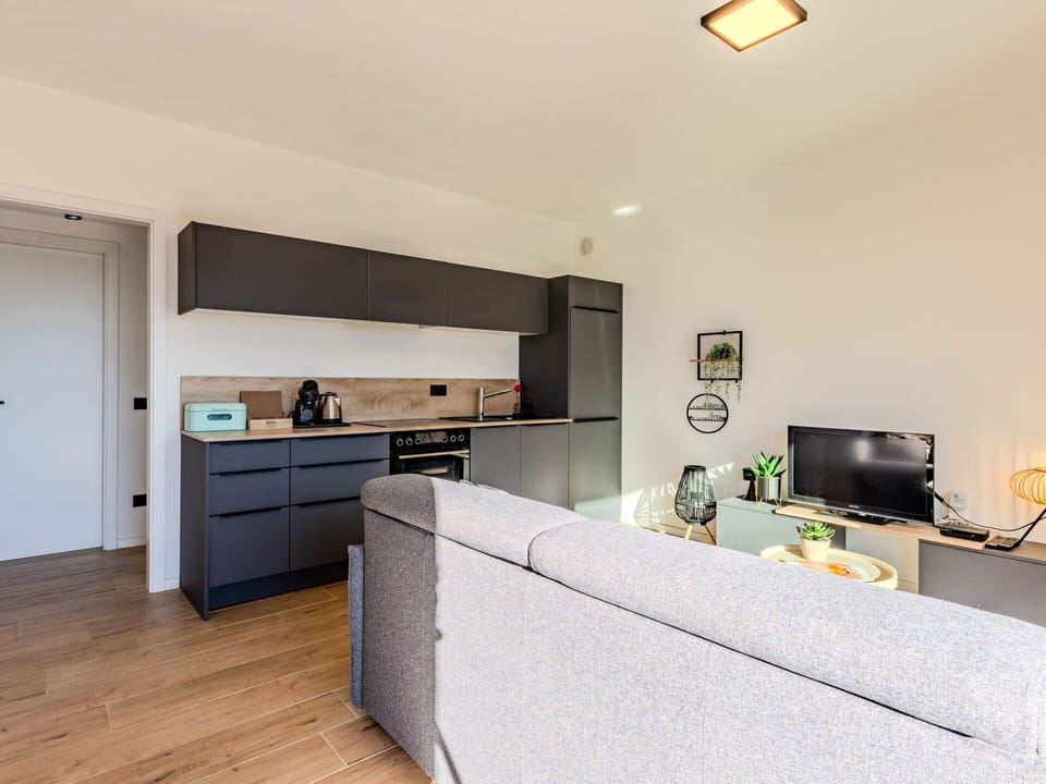 Furniture, Interior Design, Flooring, Ceiling, Kitchen, Floor, Room, Cabinetry, Lighting, Countertop