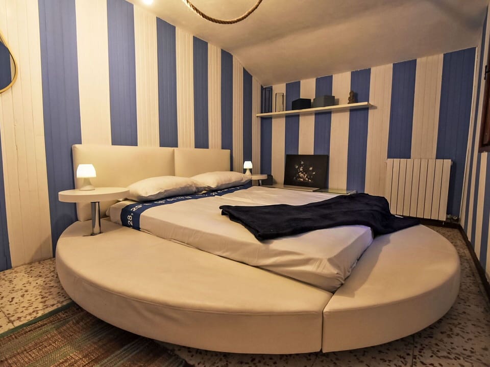 Bed, Bedroom, Interior Design, Furniture, Bed Sheet, Bedding, Linens, Floor, Flooring, Lighting