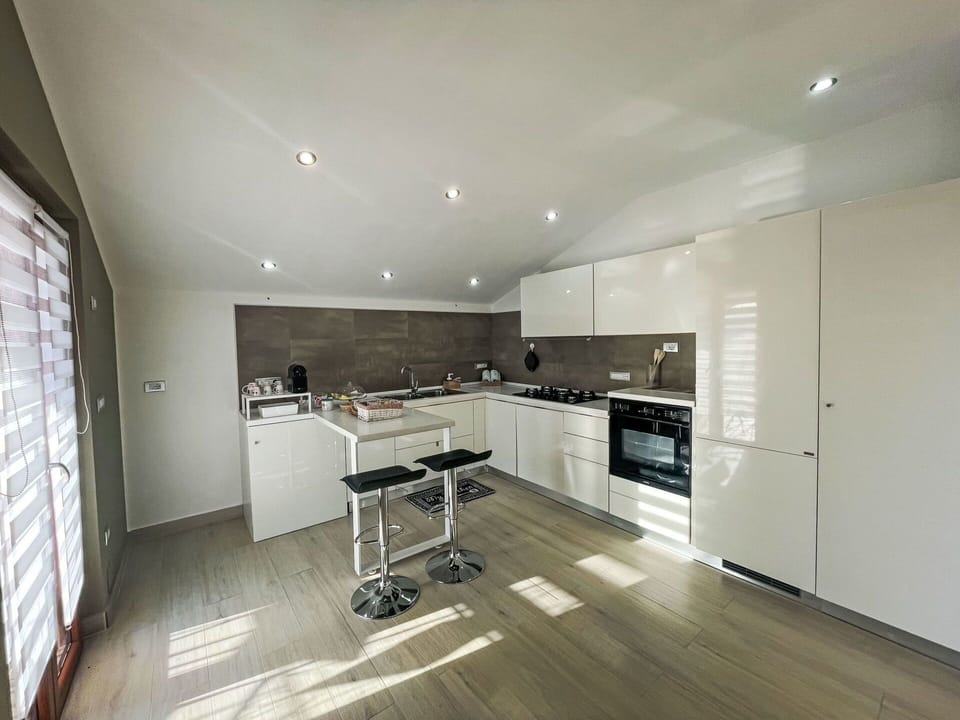 Kitchen, Countertop, Kitchen Appliance, Flooring, Interior Design, Major Appliance, Cabinetry, Ceiling, Furniture, Wood