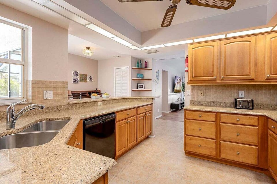 Large Kitchen with Views of the Living Room and Views of the Pool