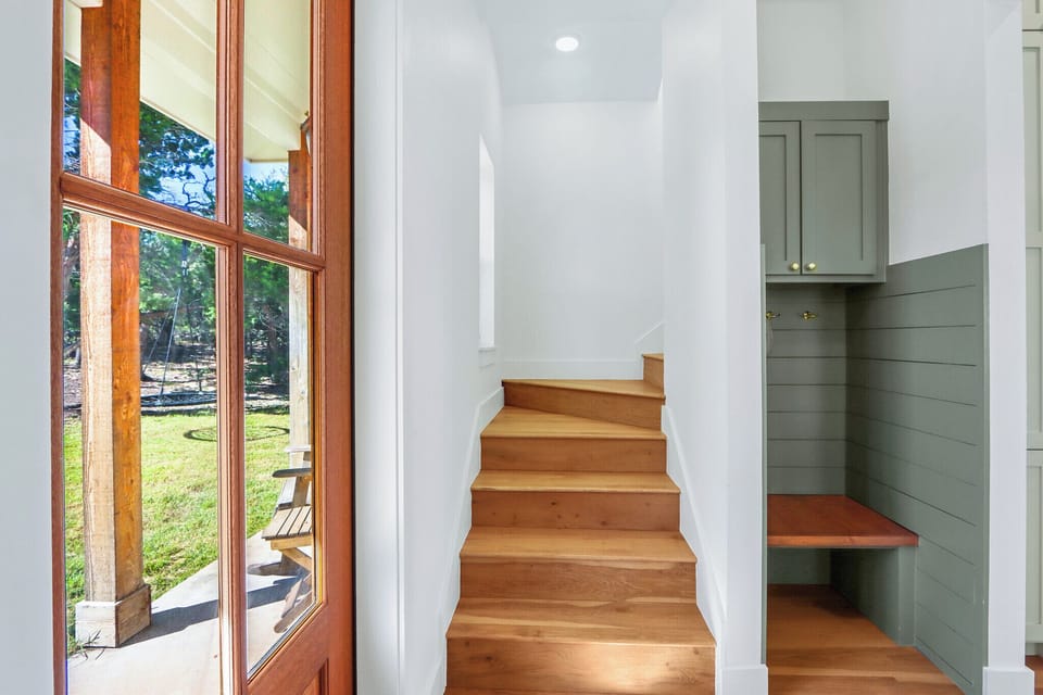 Stairs to the upper level in the foyer
