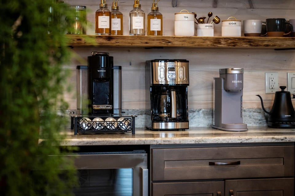Mini coffee nook for our coffee loving guests. Nespresso, Keurig coffee maker, and a coffee maker. We also have french press and some syrups for your daily coffee fix. We use 1883 syrups for your latte flavoring