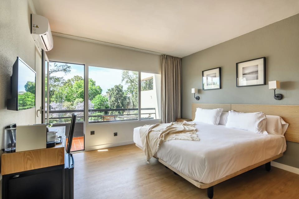 Double Room, Balcony, Garden View | Minibar, laptop workspace, blackout drapes, free cribs/infant beds