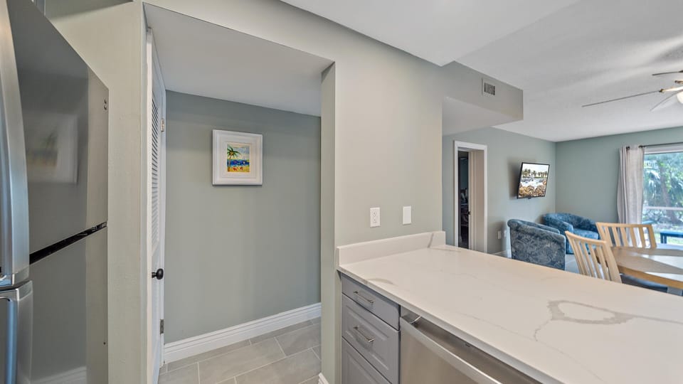 Enjoy the bright, welcoming atmosphere created by the fresh paint, modern tile, and charming coastal decor that extends seamlessly throughout this renovated Longboat Key condo.