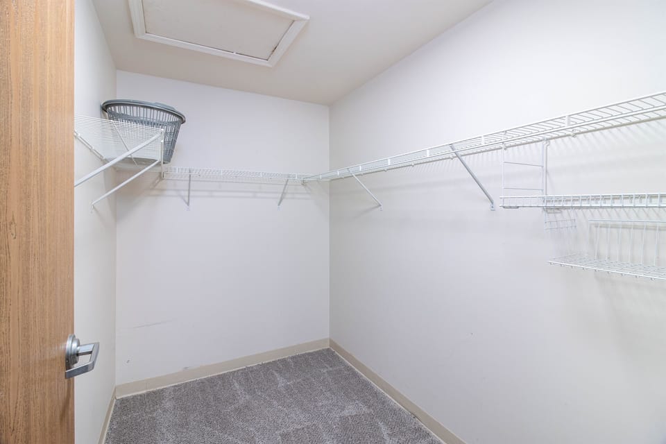 This empty closet picture highlights its generous storage potential. With ample shelving and hanging space, it's a blank slate ready to accommodate your organizational needs.