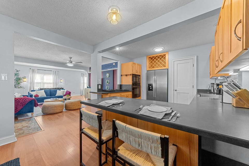 Kitchen counter with table setup for dining for 2