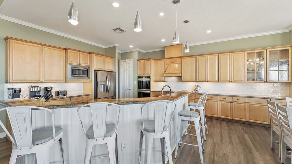 Gourmet kitchen with premium appliances and ample counter space - ideal for preparing family feasts or quick beach snacks.