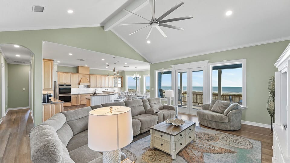 Relax in our spacious living area with plush seating and panoramic views - perfect for morning coffee or evening gatherings.