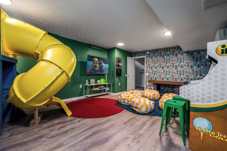 The ultimate kids’ zone—slide, movies, arcade games, and space to play for hours. Good luck getting them to leave!